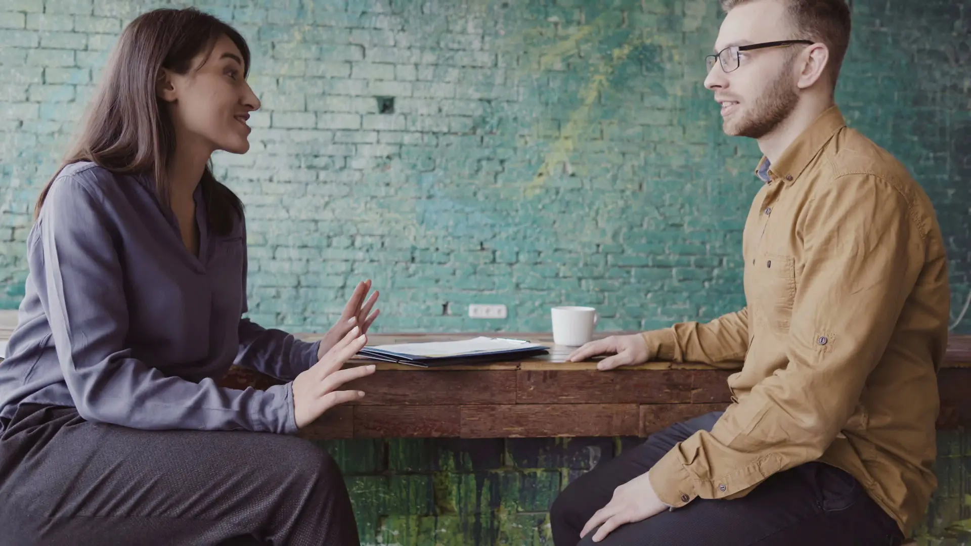 Header image with background of a girl interviewing a boy