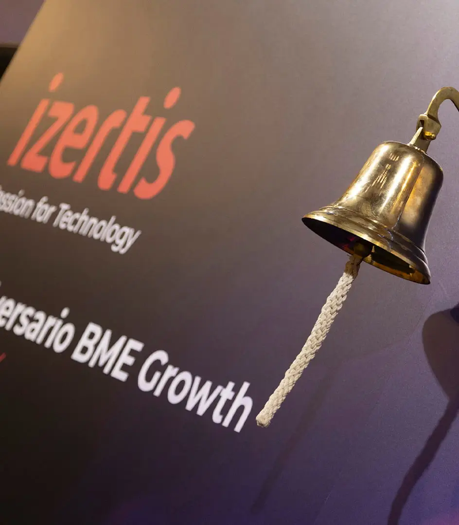 Commemorative bell marking Izertis’ anniversary on BME Growth, symbolizing the start of its stock market journey.