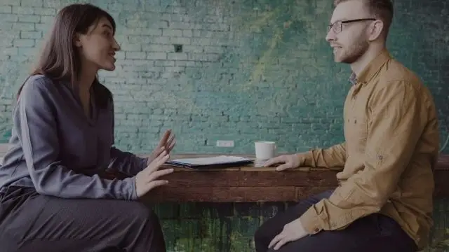 Header image with background of a girl interviewing a boy